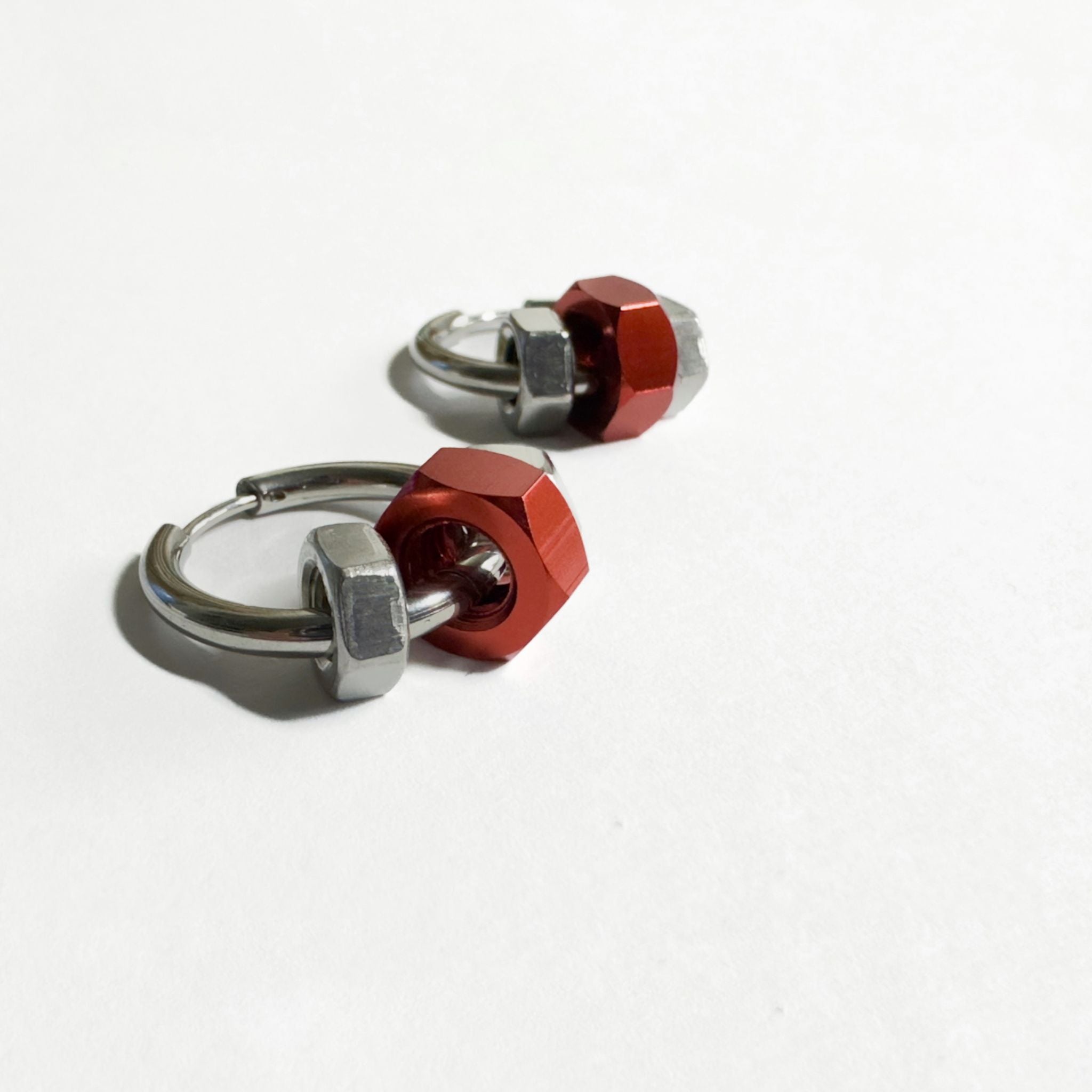 Stainless steel earrings with red and silver hex nuts