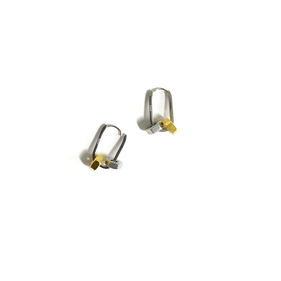 Silver earrings with silver and gold hex nuts