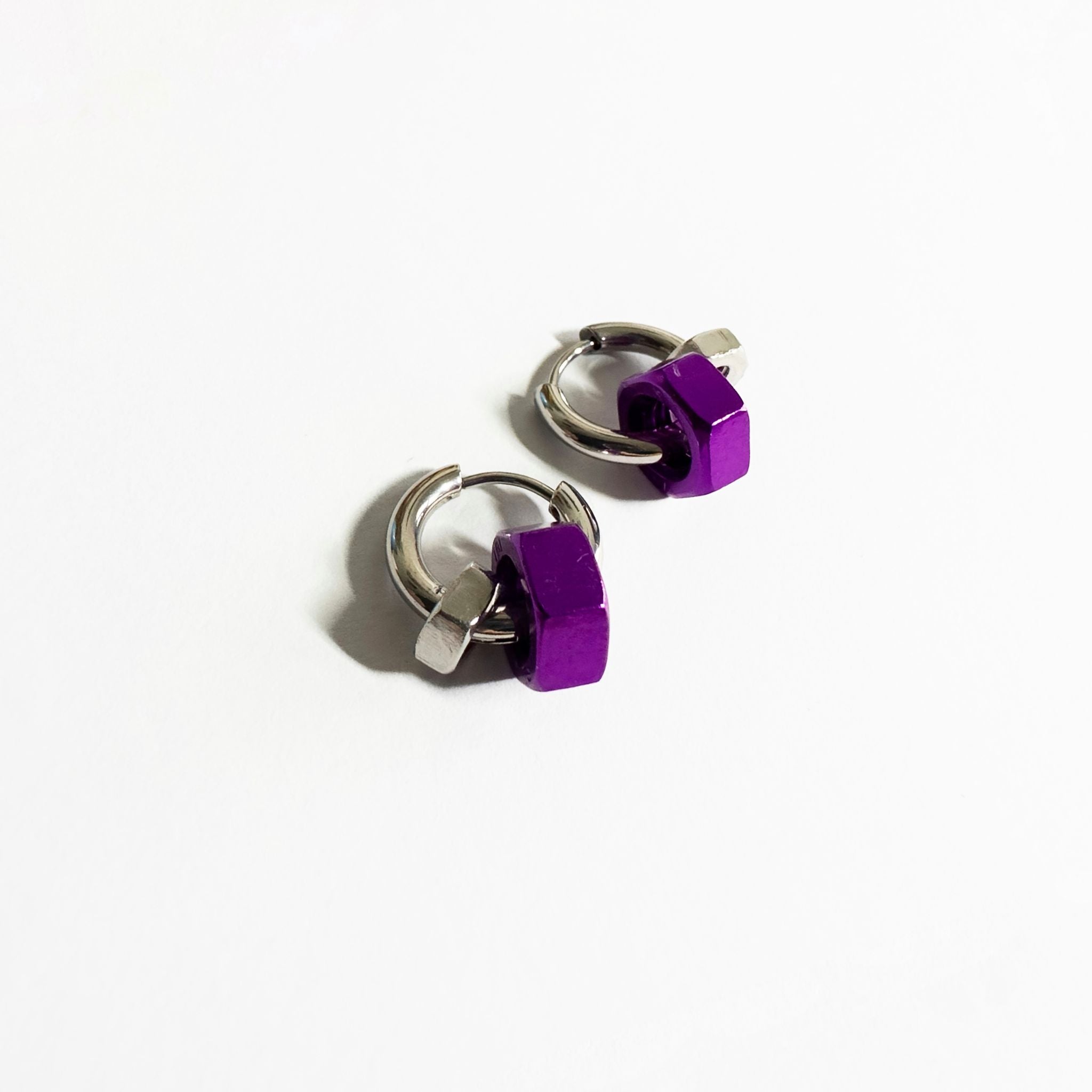 Stainless steel earrings with purple and silver hex nuts