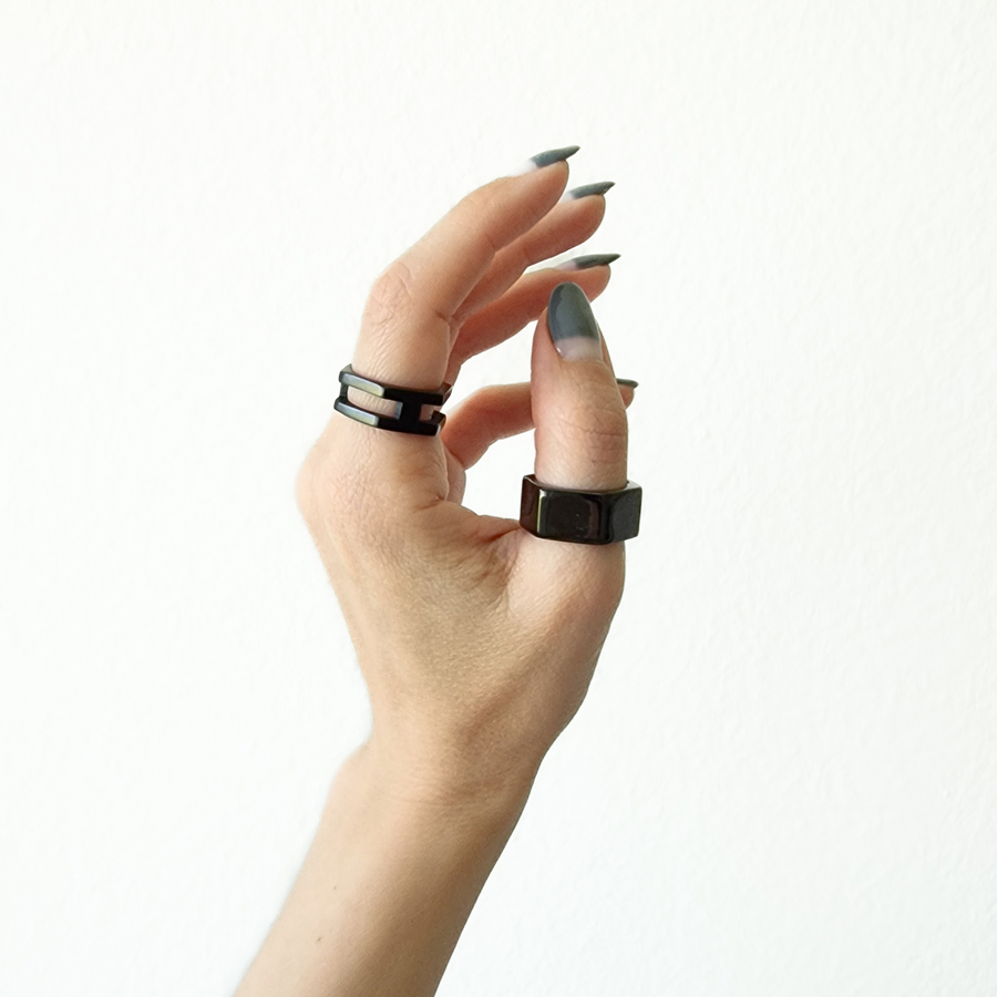 Minimalist hexagon ring made from polished black steel, a perfect unisex accessory